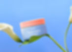 Product image for a face cream brand featuring a transparent video element. 